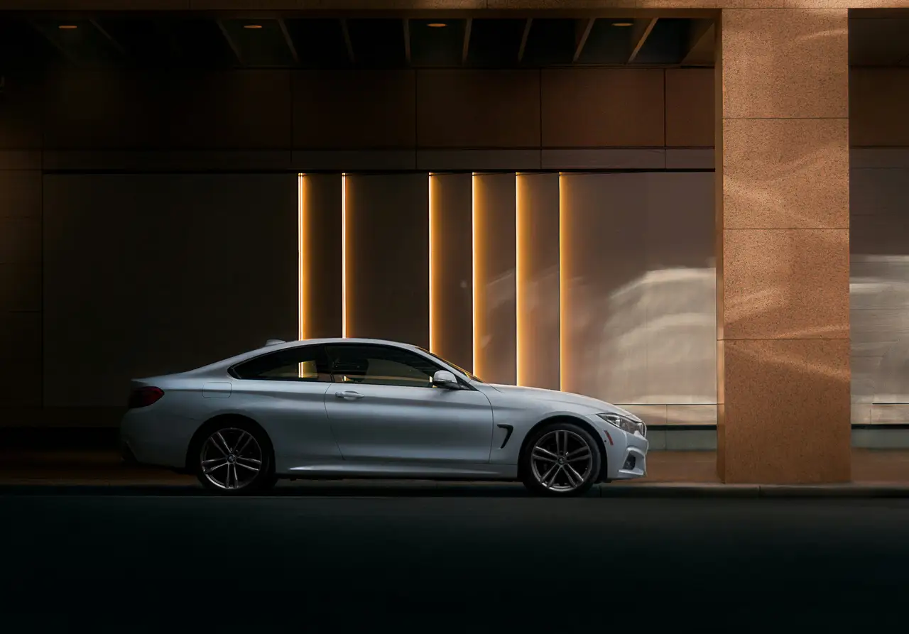 Silver premium coupe in a refined architectural setting